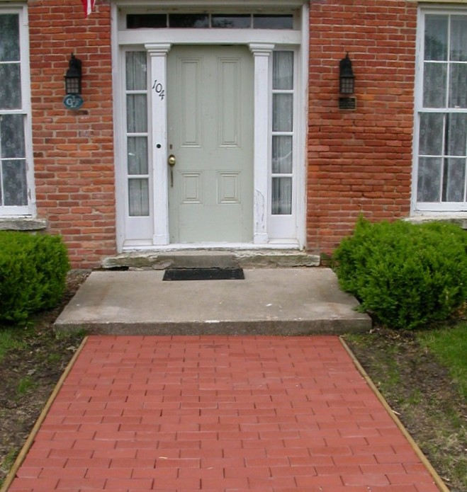 (front door and brick sidewalk of the Adlai Stevenson I house)